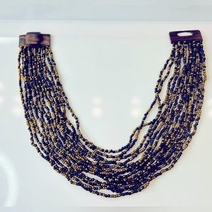 Beaded black and golden multilayered necklace / bib